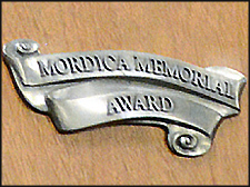 Mordica Memorial Award A closeup of the Mordica Memorial Award plaque.